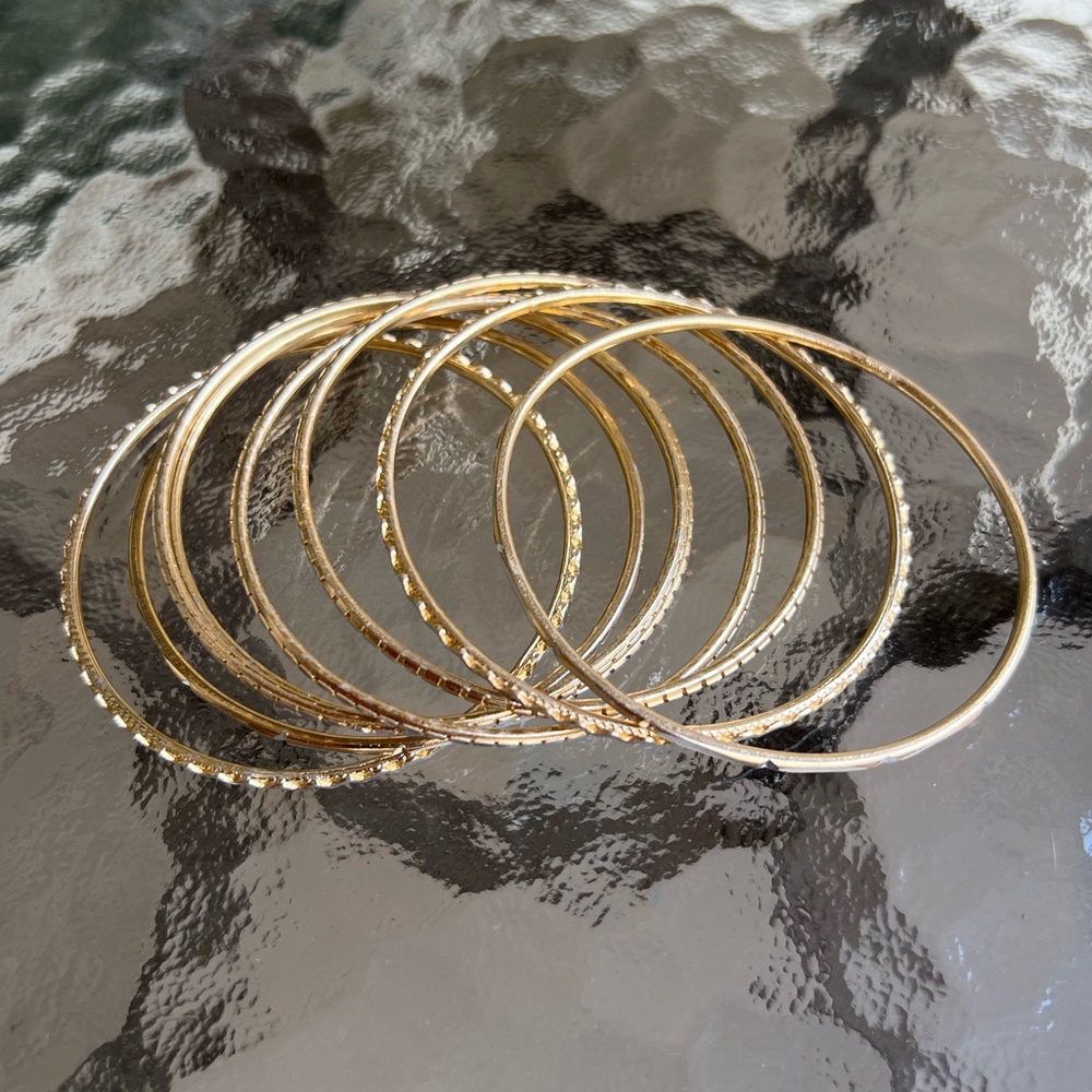 8pc Bangle set diameter 2.75” metal color gold with etched design